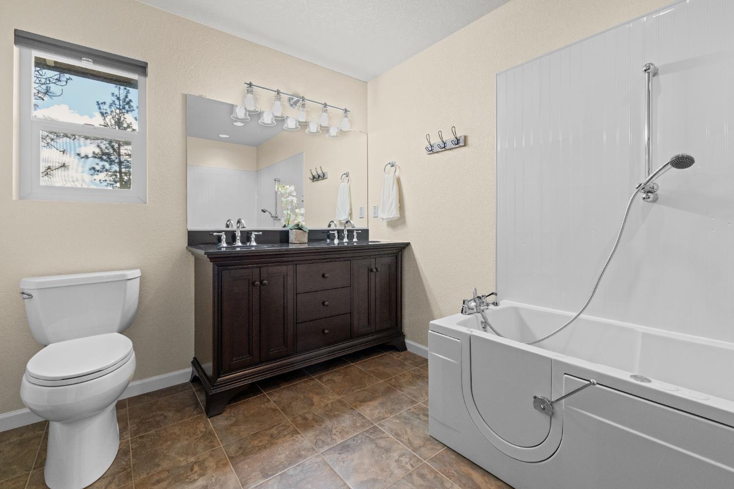 6139 Green Ridge Drive Foresthill, CA 95631 - Photo 23 of 30 a bathroom with a toilet sink and mirror