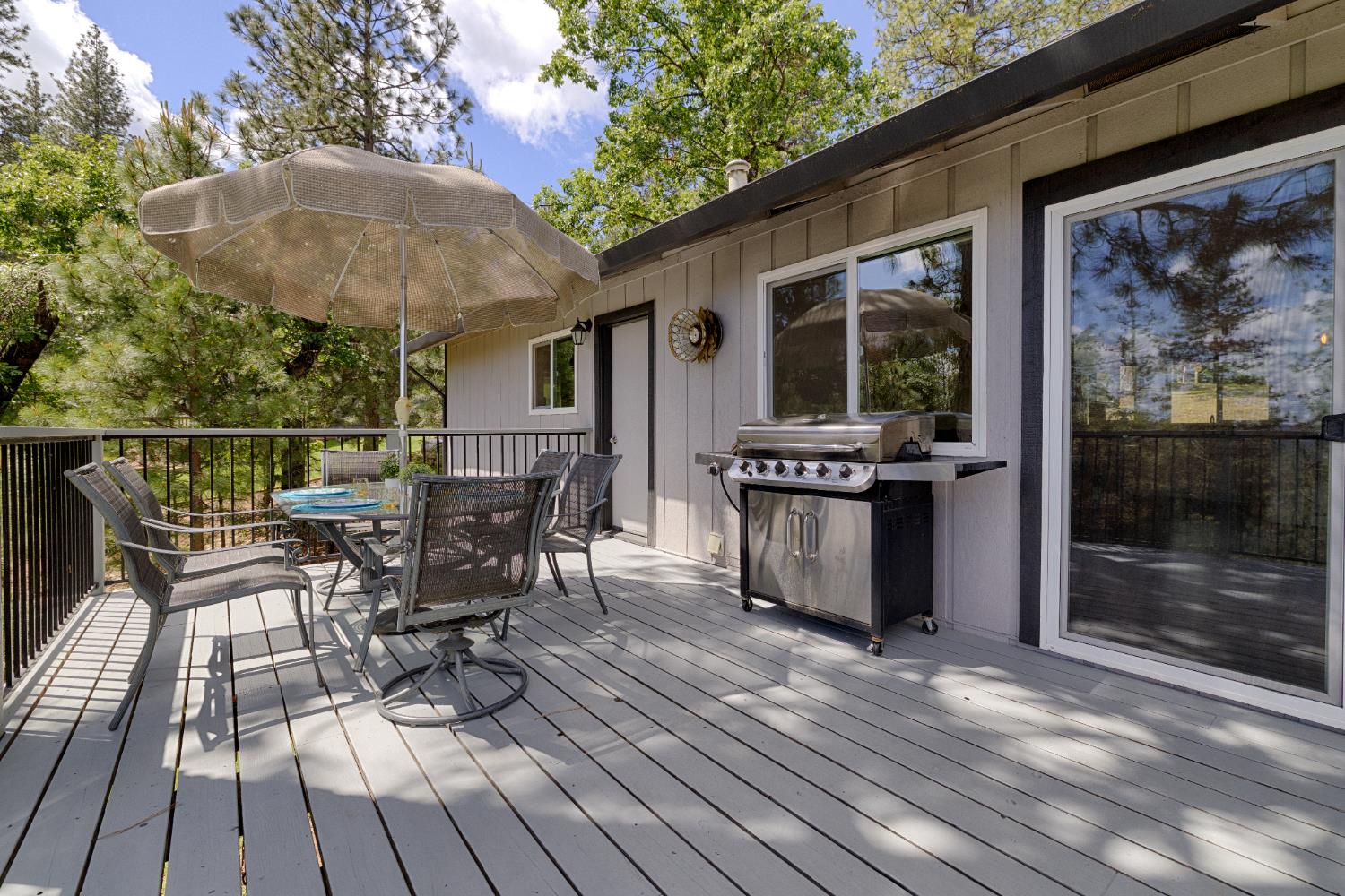 6139 Green Ridge Drive Foresthill, CA 95631 - Photo 26 of 30 a view of a patio with table and chairs with wooden floor and fence