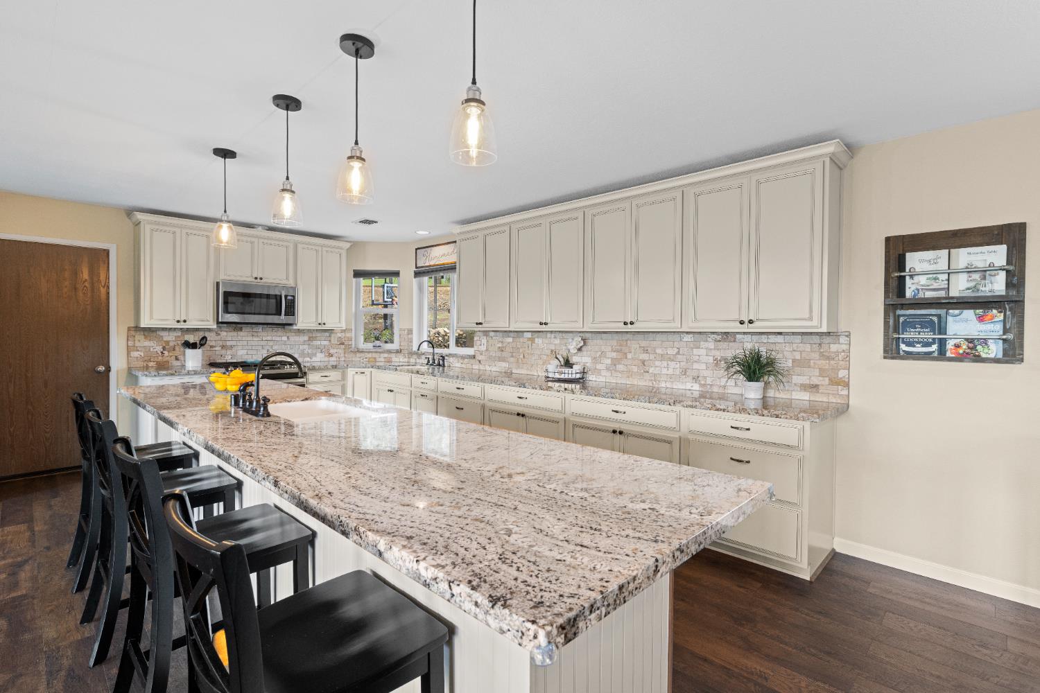 6139 Green Ridge Drive Foresthill, CA 95631 - Photo 7 of 30 a large kitchen with granite countertop a stove a sink a kitchen island with stainless steel appliances