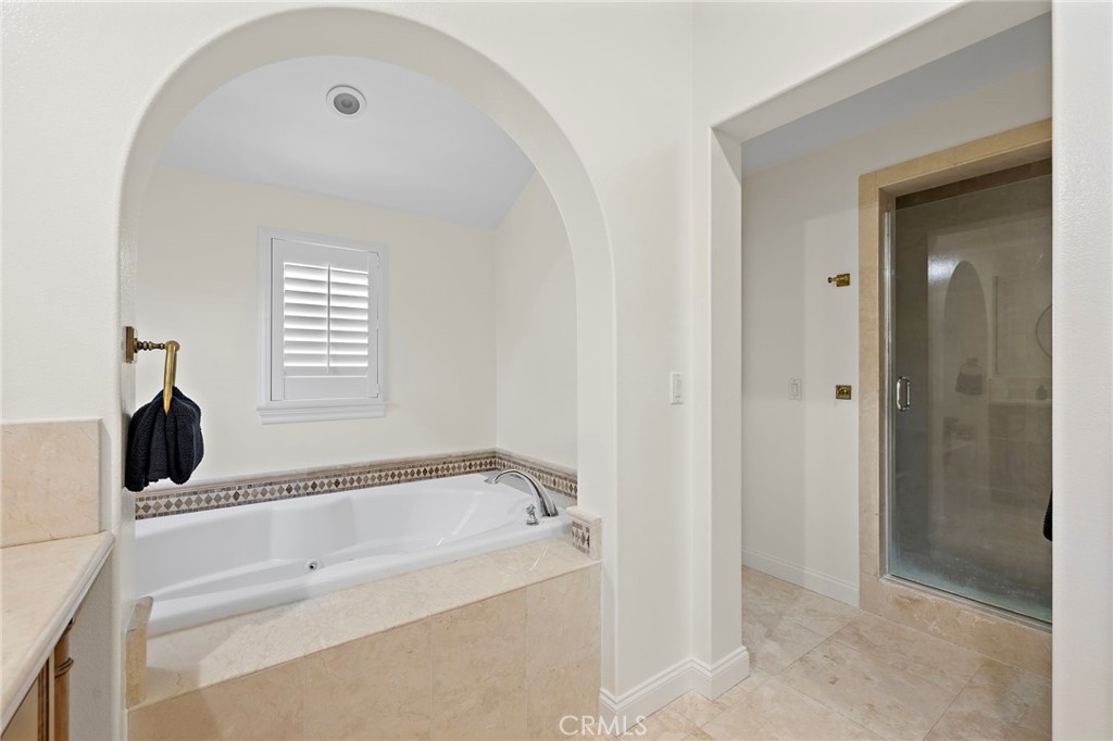 3 Tranquility Place Ladera Ranch, CA 92694 - Photo 29 of 63 a bathroom with a bathtub and a shower