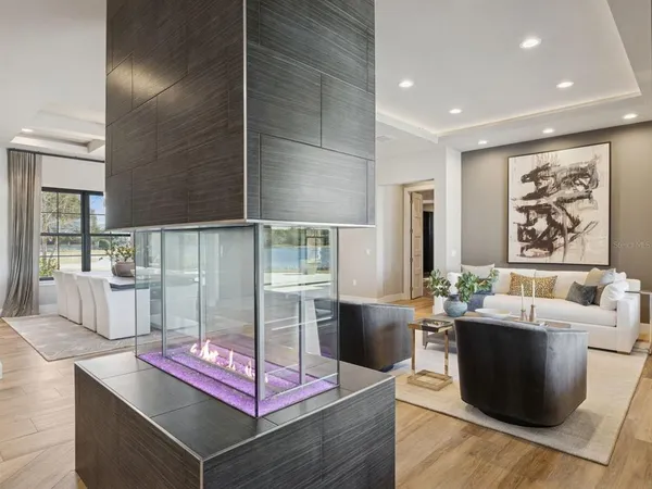 a kitchen with kitchen island granite countertop a table and chairs in it