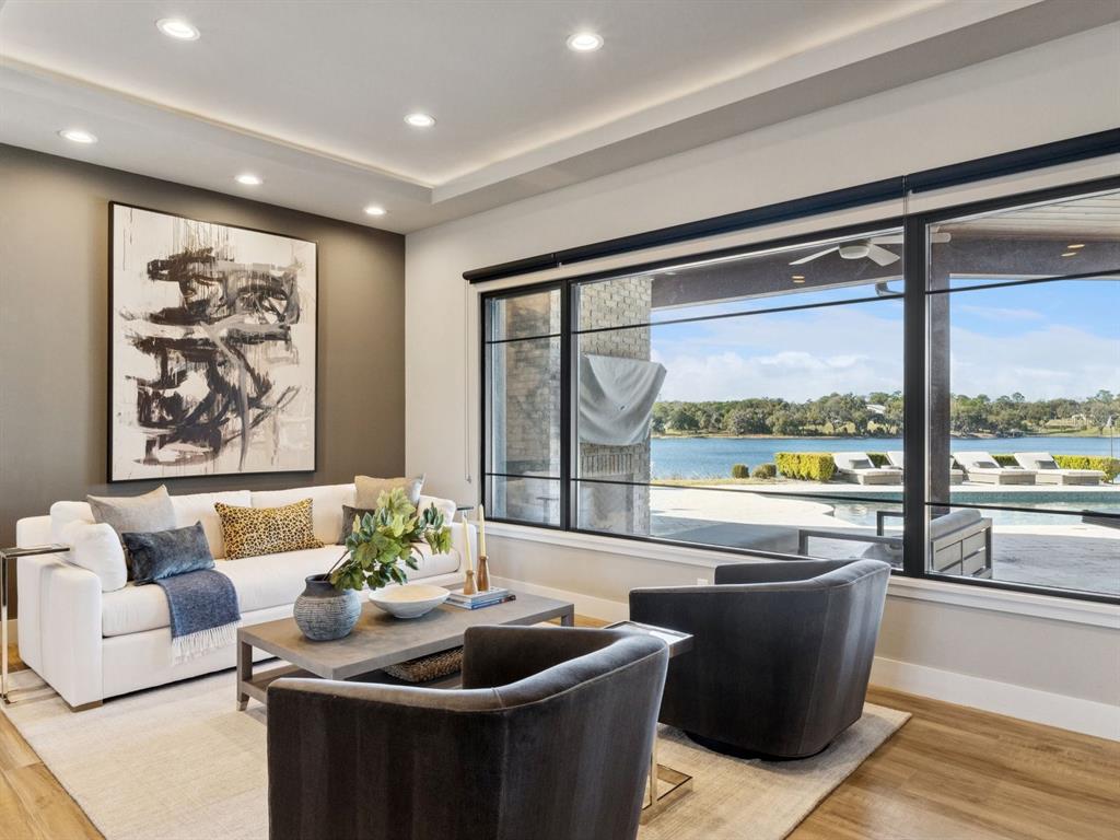 22151 Lake Seneca Road Eustis, FL 32736 - Photo 13 of 77 a living room with furniture and a large window