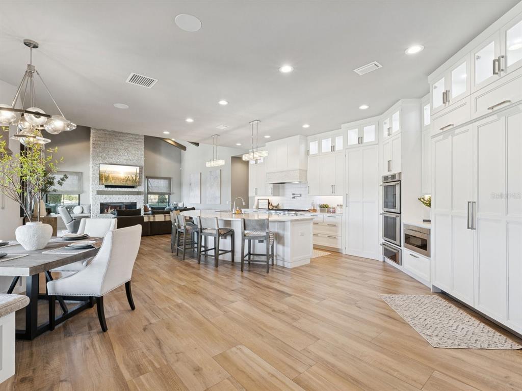 22151 Lake Seneca Road Eustis, FL 32736 - Photo 20 of 77 a large kitchen with a table and chairs