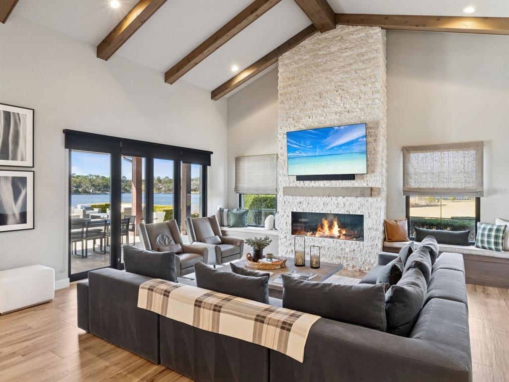 22151 Lake Seneca Road Eustis, FL 32736 - Photo 25 of 77 a living room with furniture fireplace and a large window
