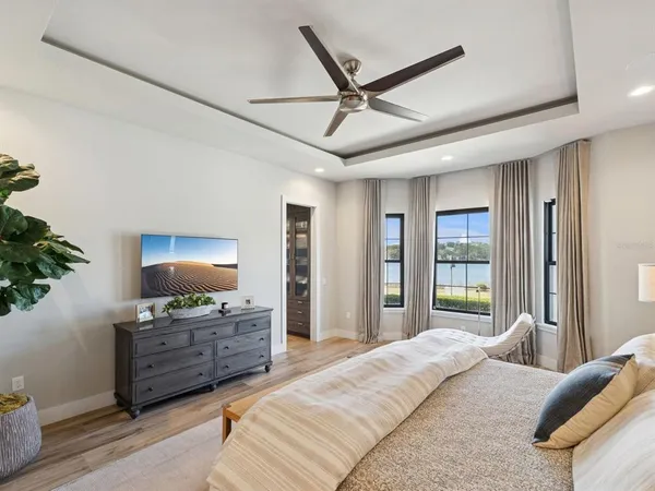 a bedroom with two beds and a large window