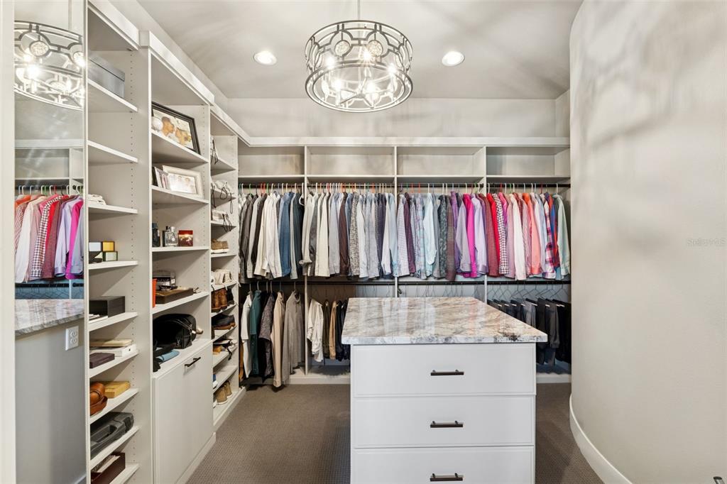 22151 Lake Seneca Road Eustis, FL 32736 - Photo 32 of 77 a view of walk in closet with clothes and shoes