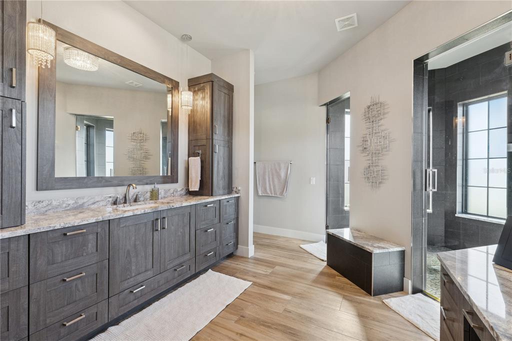 22151 Lake Seneca Road Eustis, FL 32736 - Photo 33 of 77 a spacious bathroom with a granite countertop sink mirror and a