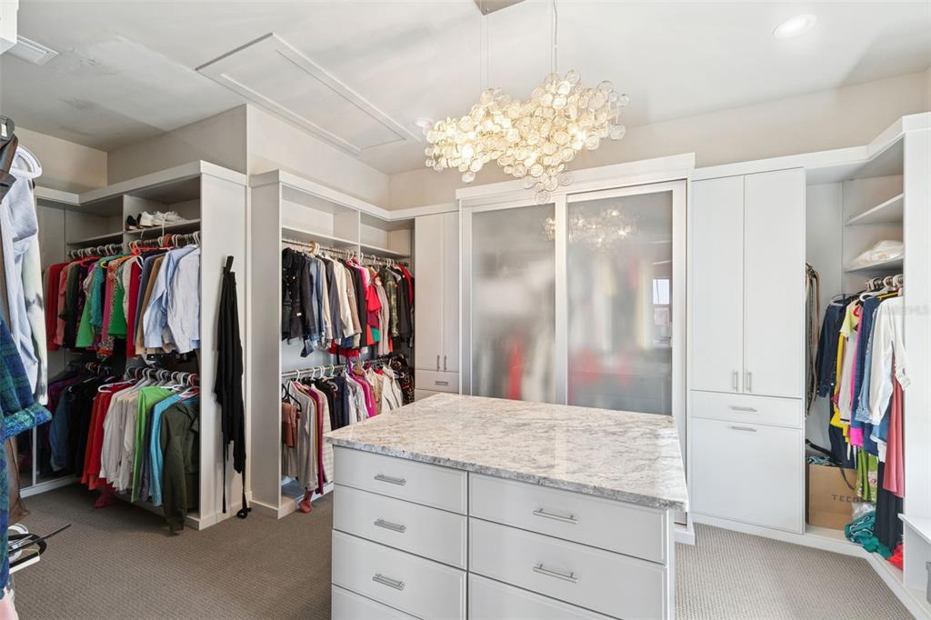 22151 Lake Seneca Road Eustis, FL 32736 - Photo 34 of 77 a view of walk in closet with clothes
