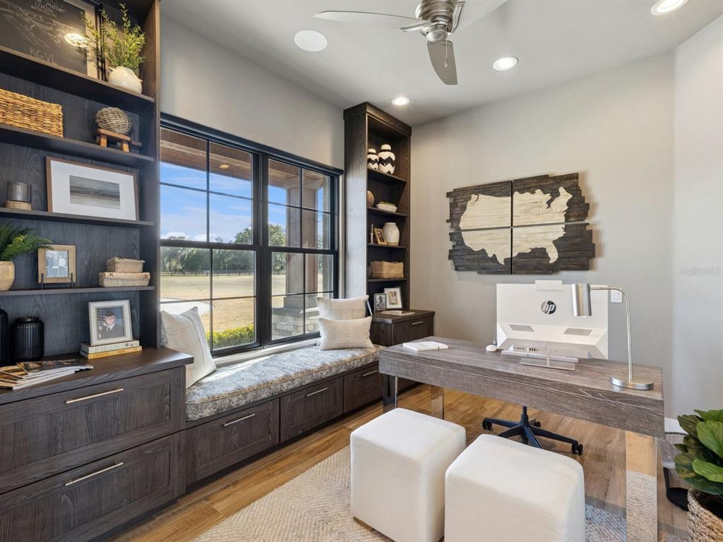 22151 Lake Seneca Road Eustis, FL 32736 - Photo 36 of 77 a living room with furniture and a flat screen tv