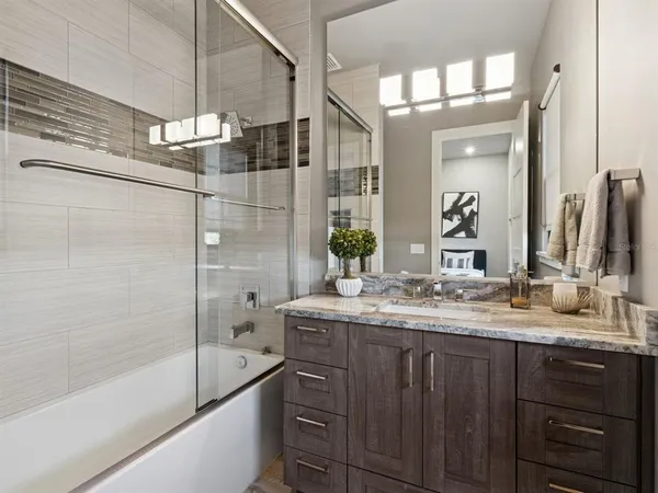 a view of a house with swimming pool and sitting area