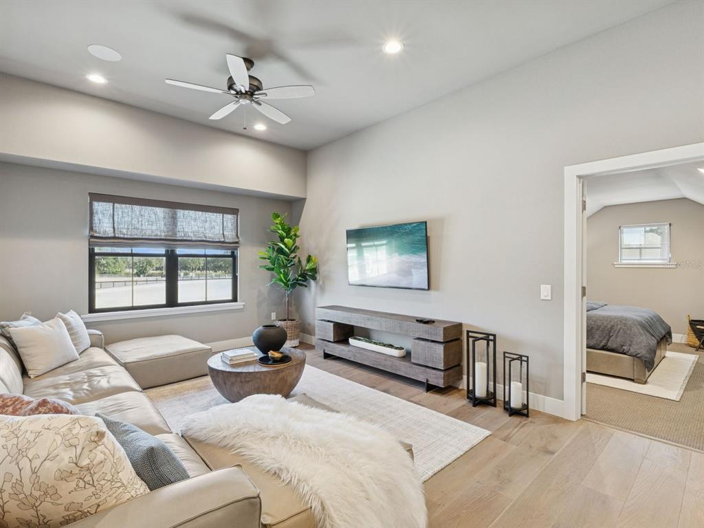 22151 Lake Seneca Road Eustis, FL 32736 - Photo 45 of 77 a living room with furniture and a large window