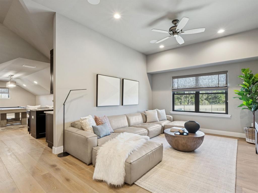 22151 Lake Seneca Road Eustis, FL 32736 - Photo 46 of 77 a living room with furniture and a window
