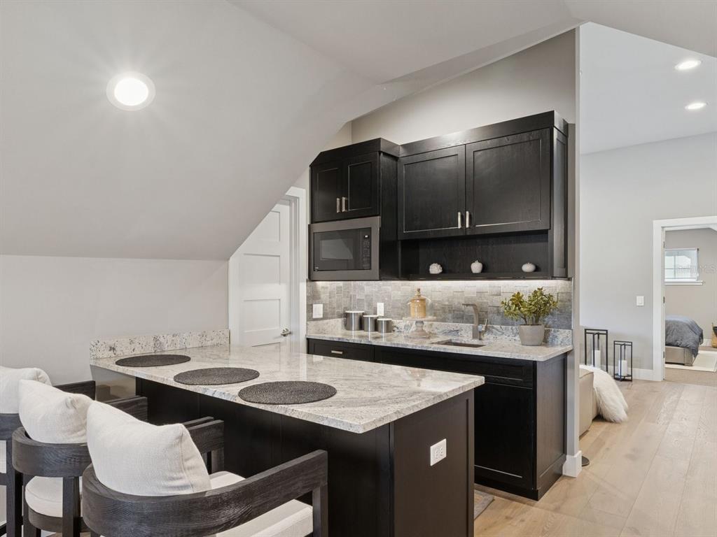 22151 Lake Seneca Road Eustis, FL 32736 - Photo 47 of 77 a kitchen with a sink and cabinets