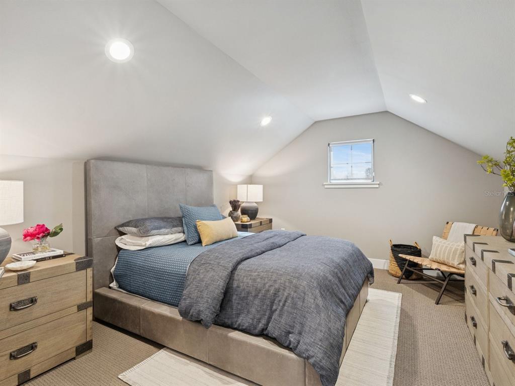 22151 Lake Seneca Road Eustis, FL 32736 - Photo 50 of 77 a bedroom with a bed and a window