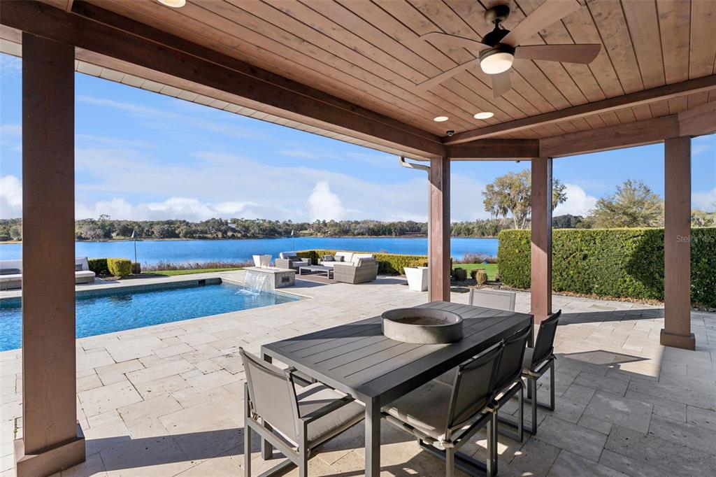 22151 Lake Seneca Road Eustis, FL 32736 - Photo 59 of 77 a view of a dining room with furniture window and outside view