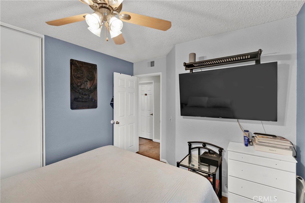 3350 May Court Riverside, CA 92503 - Photo 15 of 55 a bedroom with a bed and a flat screen tv