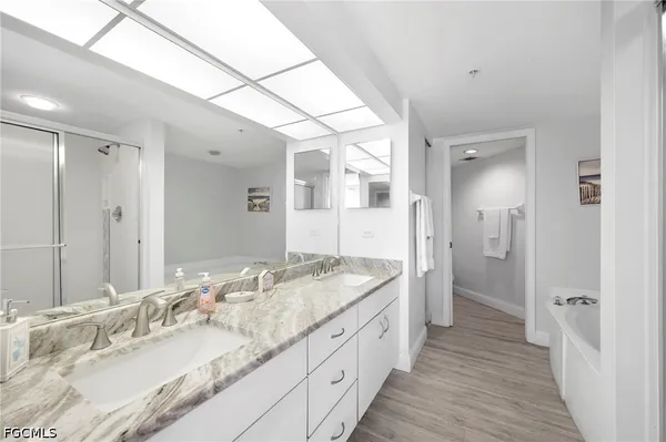 a bathroom with a bathtub and a shower