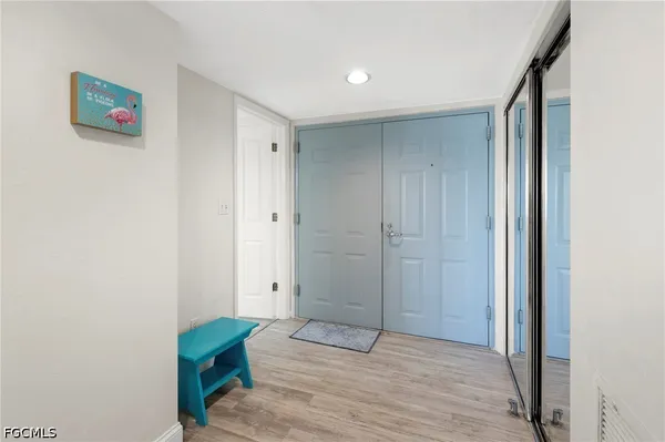 a bedroom with two beds and a flat screen tv