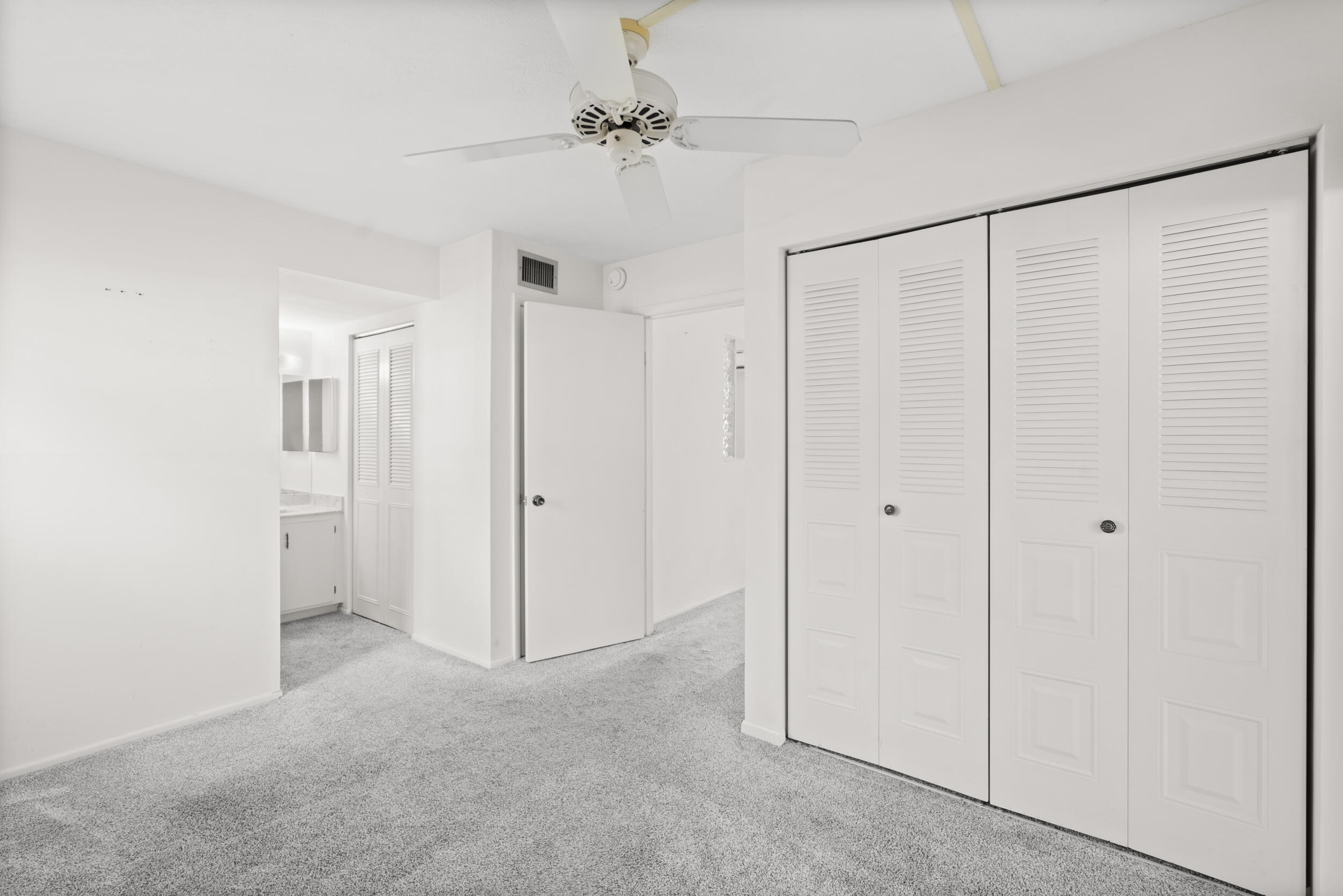 3278 Southeast Aster Lane, Unit F155 Stuart, FL 34994 - Photo 16 of 41 a view of a closet area with ceiling fan