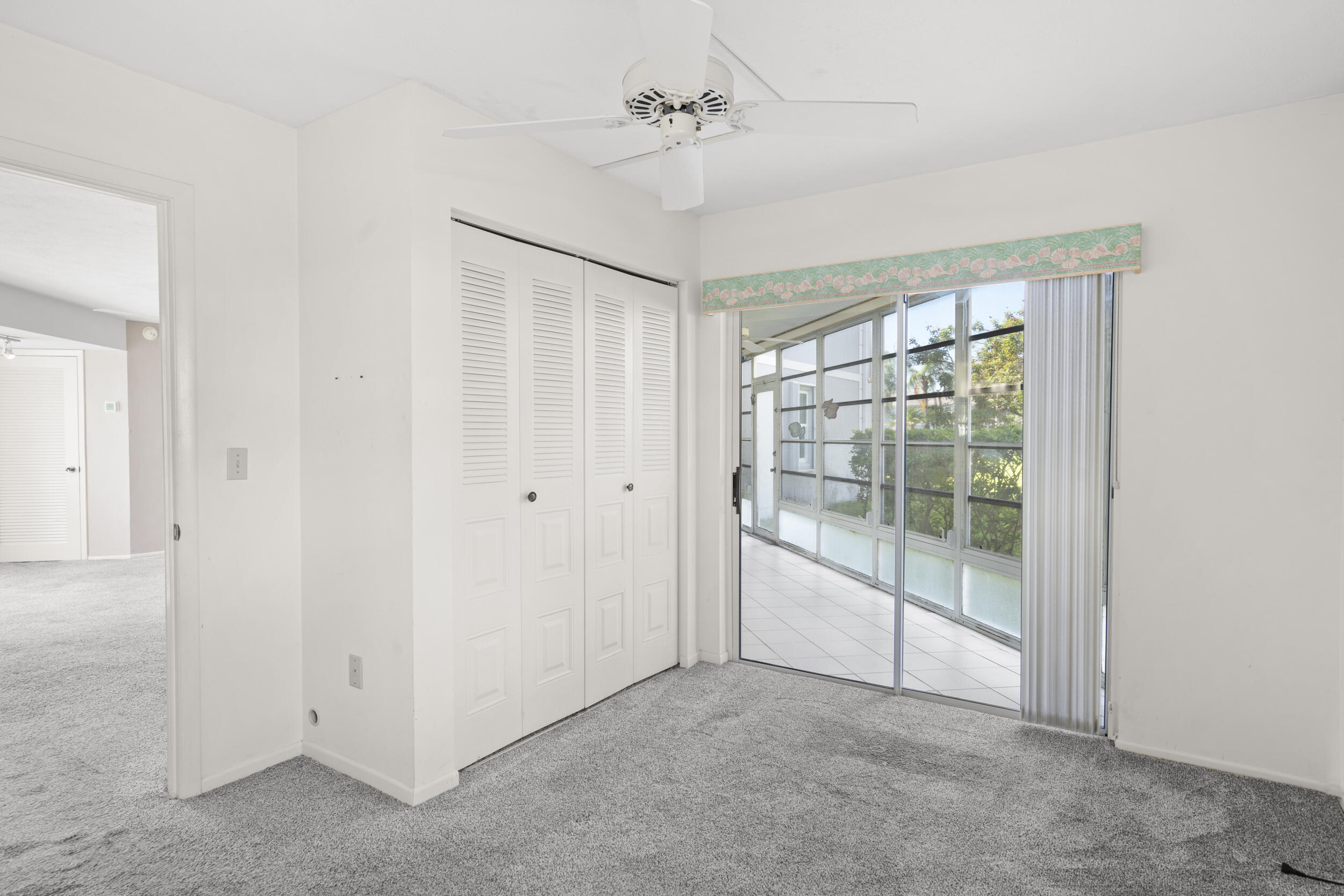 3278 Southeast Aster Lane, Unit F155 Stuart, FL 34994 - Photo 17 of 41 an empty room with windows and closet