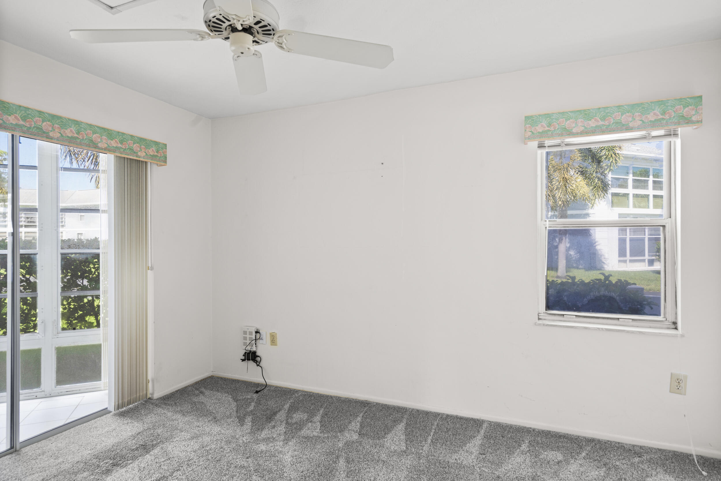 3278 Southeast Aster Lane, Unit F155 Stuart, FL 34994 - Photo 18 of 41 a view of an empty room with a window