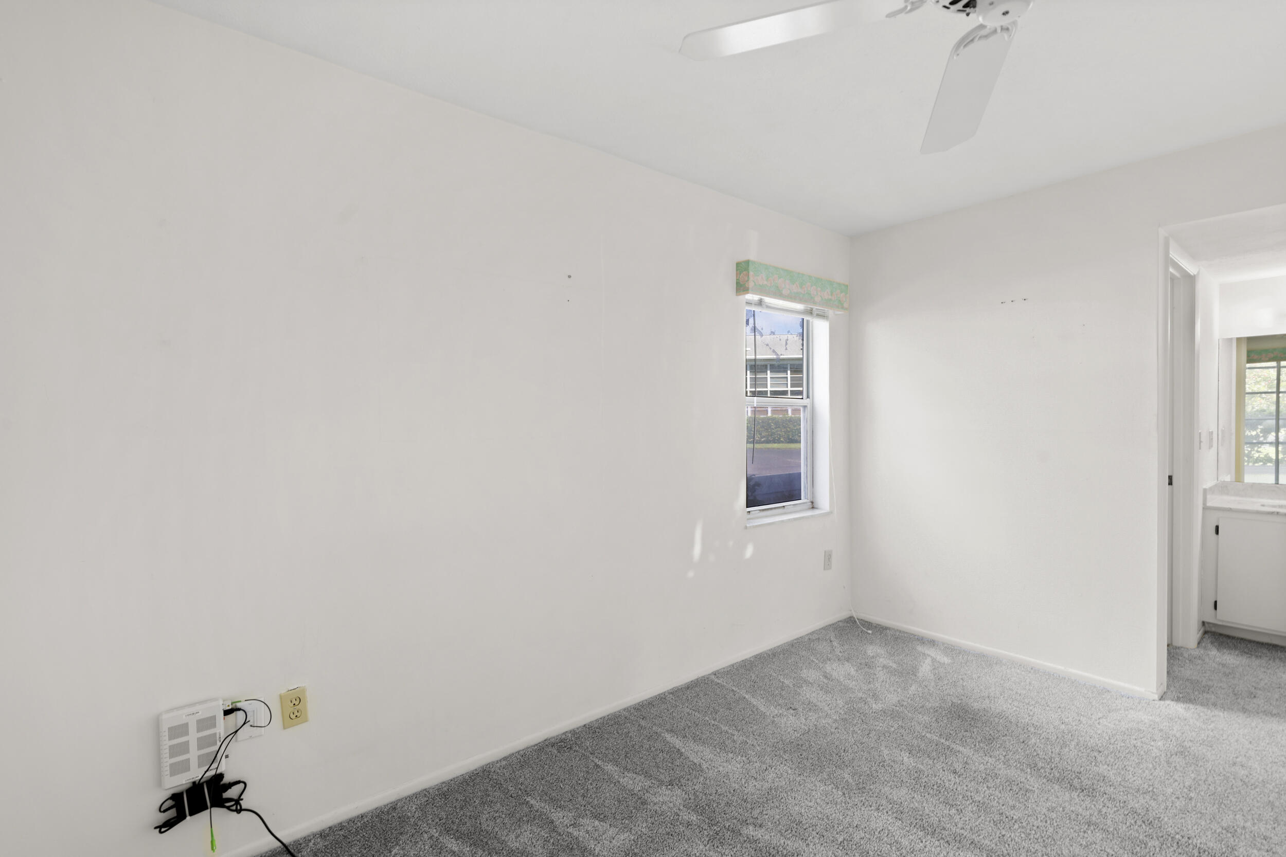 3278 Southeast Aster Lane, Unit F155 Stuart, FL 34994 - Photo 19 of 41 an empty room with a window