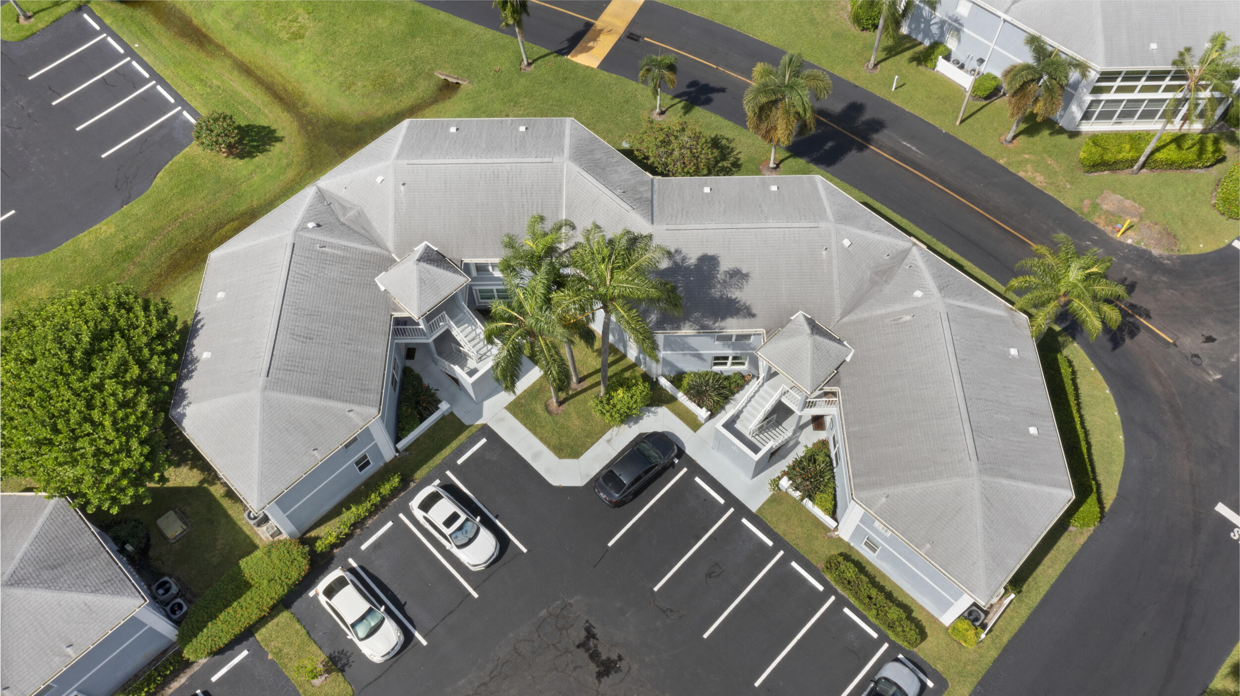 3278 Southeast Aster Lane, Unit F155 Stuart, FL 34994 - Photo 32 of 41 an aerial view of a house with a swimming pool