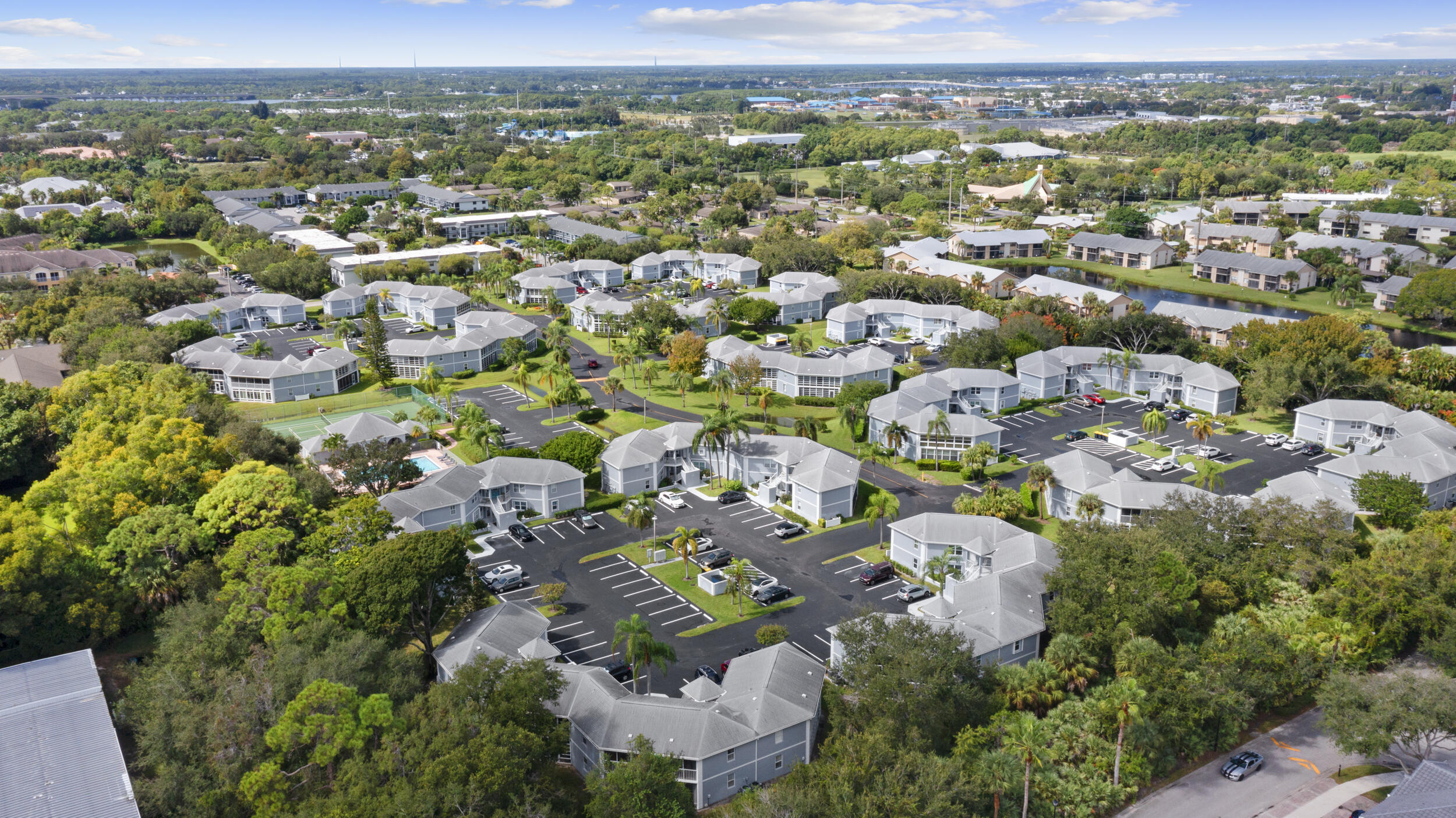 3278 Southeast Aster Lane, Unit F155 Stuart, FL 34994 - Photo 34 of 41 an aerial view of multiple house
