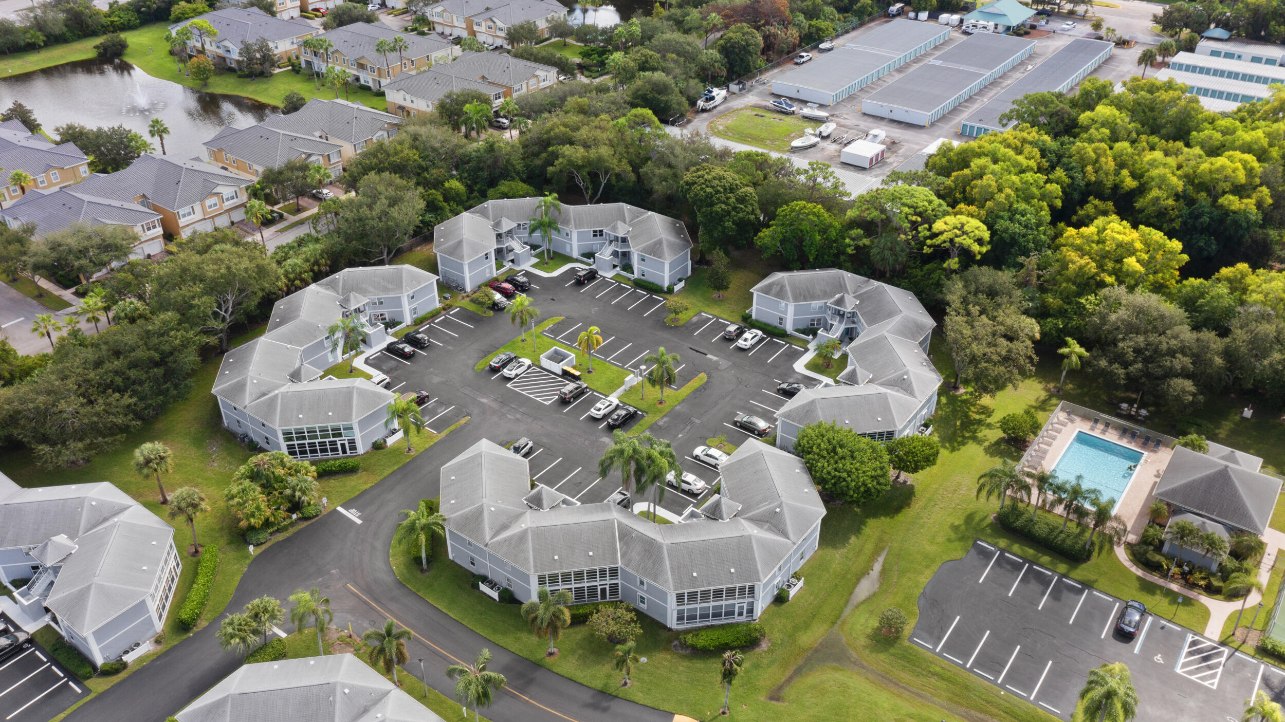 3278 Southeast Aster Lane, Unit F155 Stuart, FL 34994 - Photo 36 of 41 an aerial view of a house with table and chairs