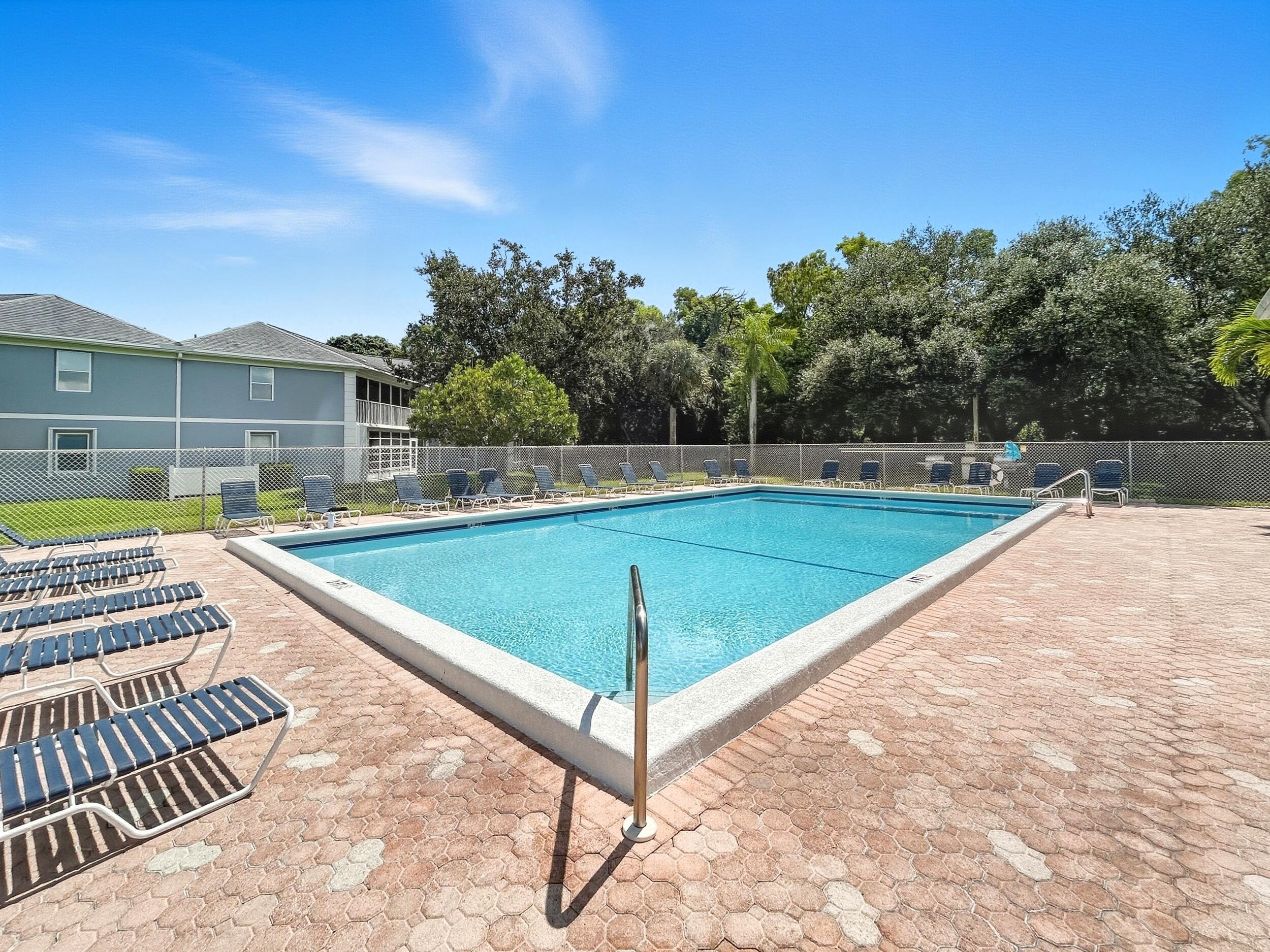 3278 Southeast Aster Lane, Unit F155 Stuart, FL 34994 - Photo 39 of 41 a view of a swimming pool with a patio