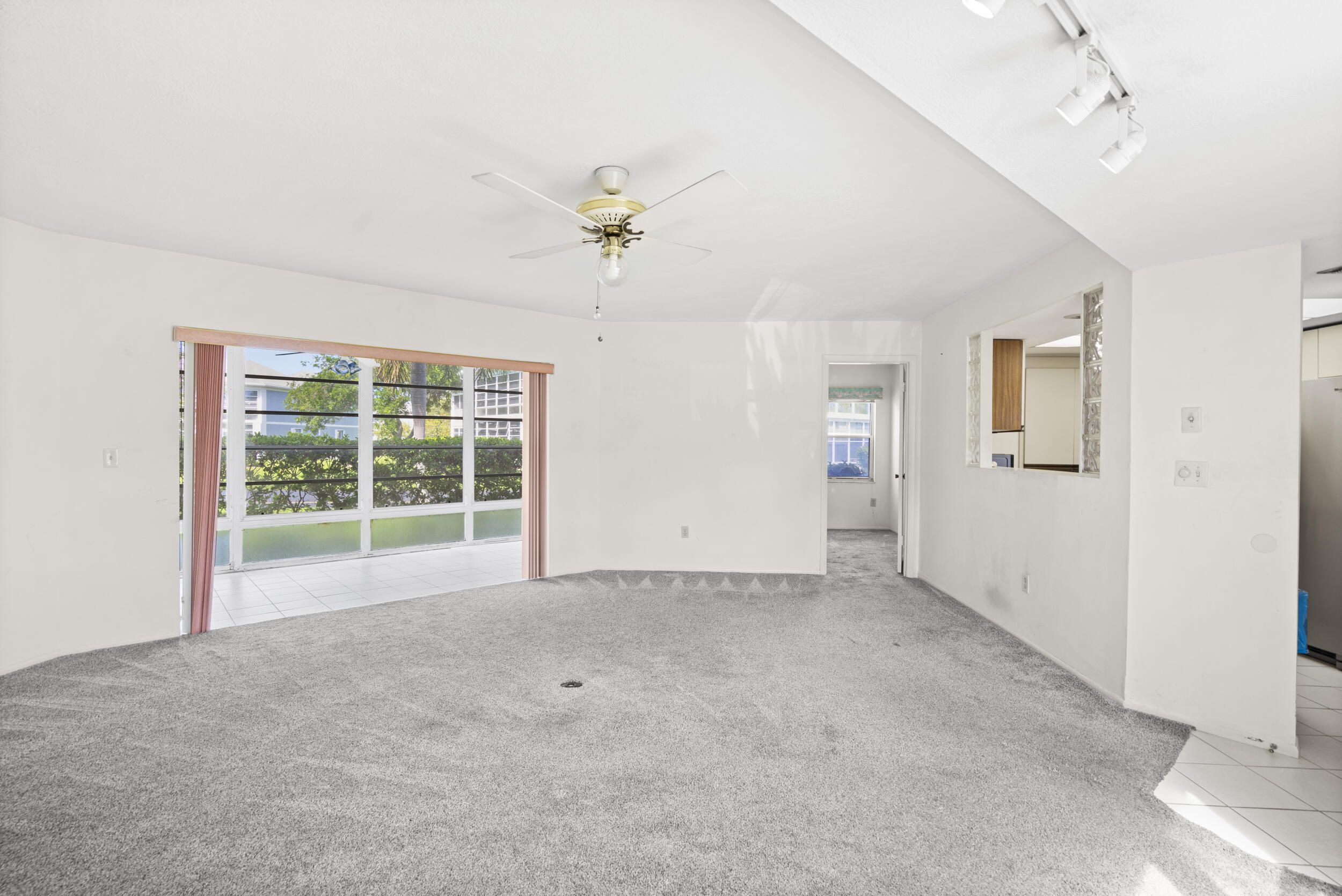 3278 Southeast Aster Lane, Unit F155 Stuart, FL 34994 - Photo 6 of 41 a view of an empty room with a window