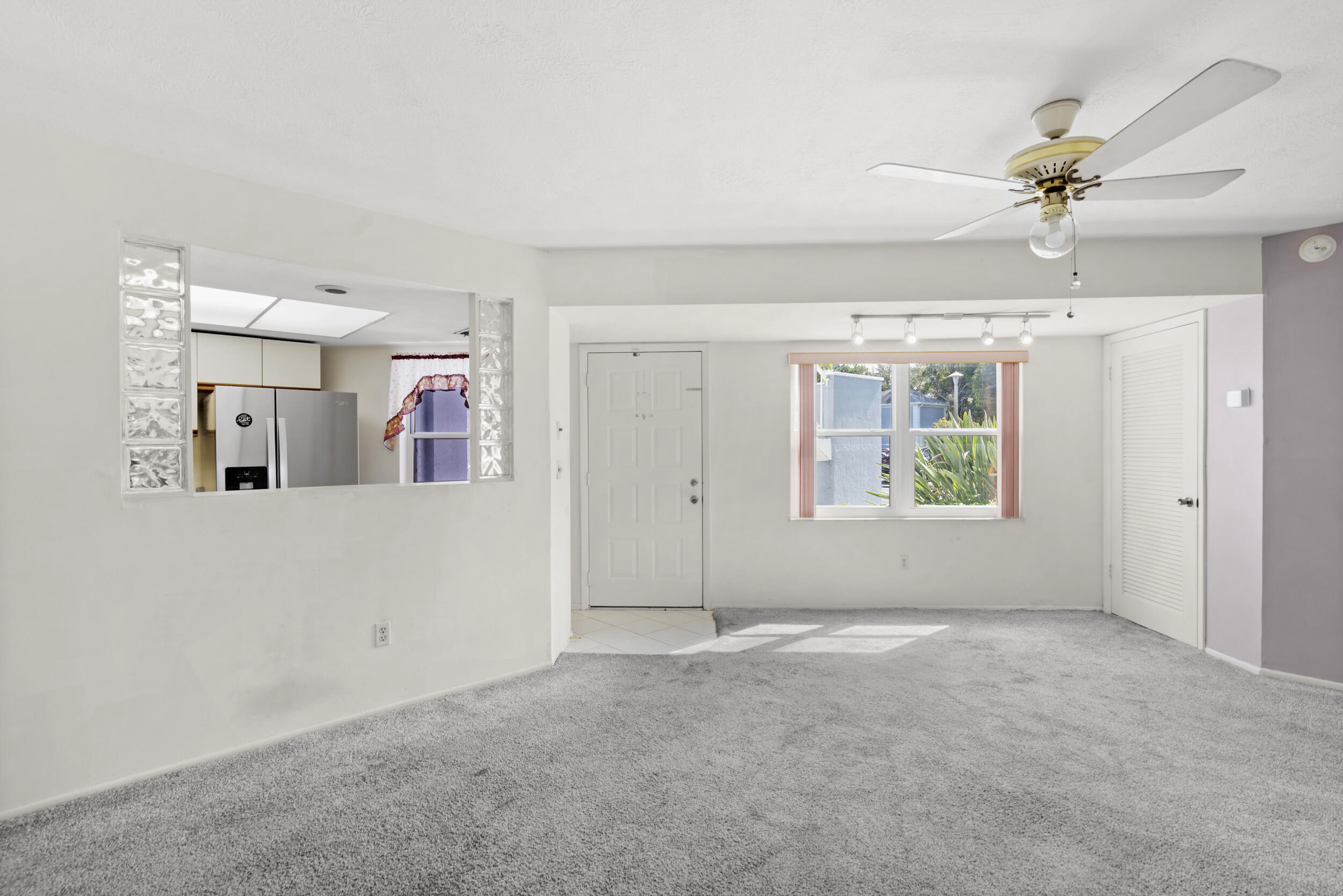 3278 Southeast Aster Lane, Unit F155 Stuart, FL 34994 - Photo 8 of 41 a view of an empty room with a window