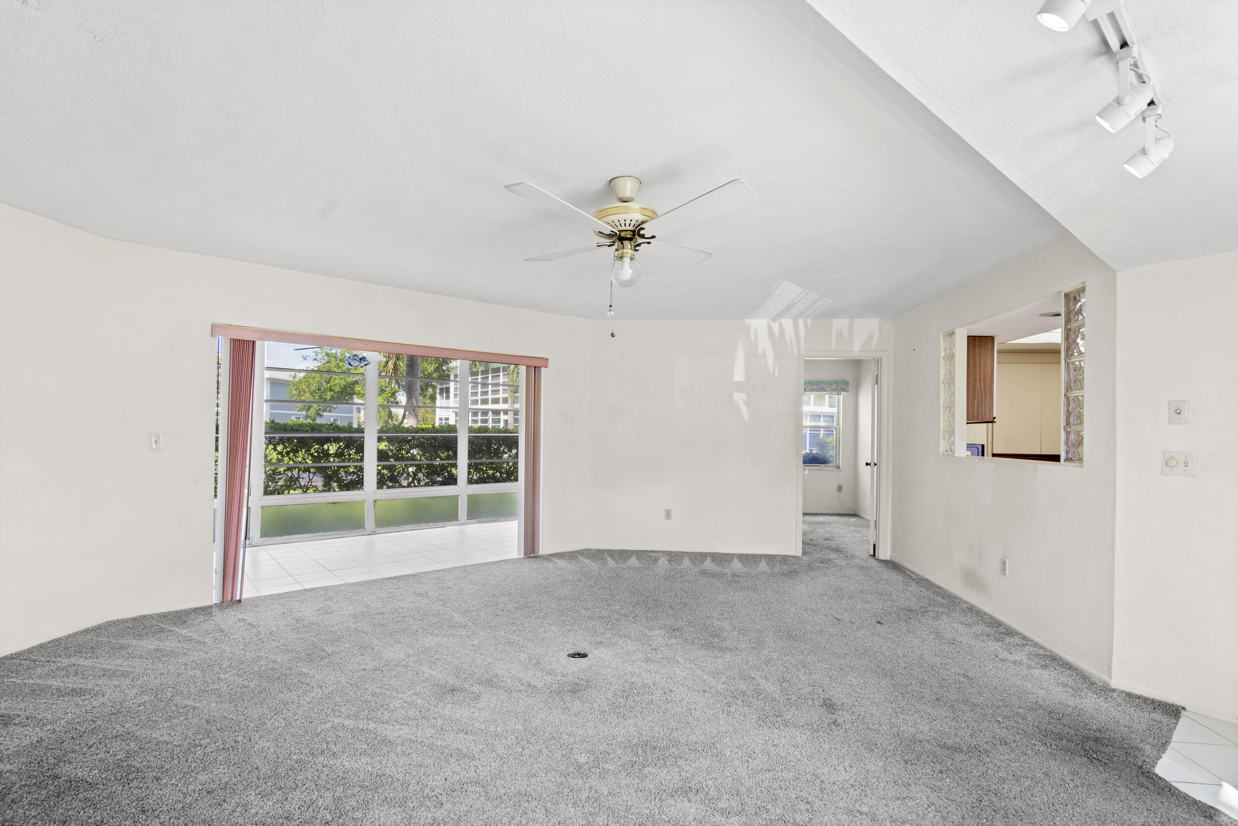 3278 Southeast Aster Lane, Unit F155 Stuart, FL 34994 - Photo 9 of 41 a view of an empty room with a window