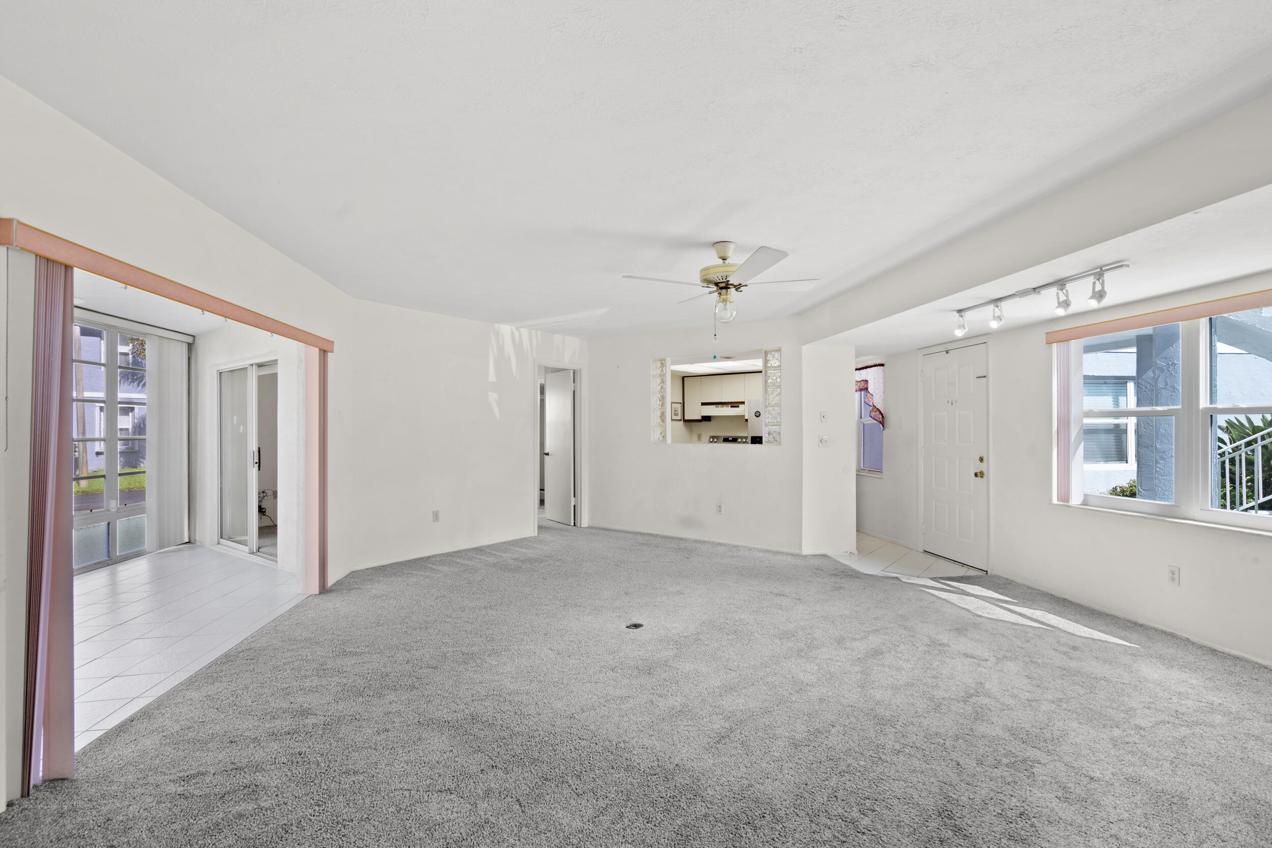 3278 Southeast Aster Lane, Unit F155 Stuart, FL 34994 - Photo 10 of 41 an empty room with windows