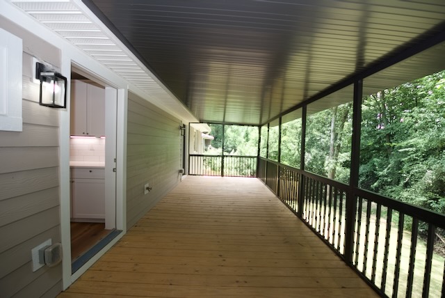 317 Pendleton Road Clemson, SC 29631 - Photo 18 of 36 A spacious covered porch extends into a serene wooded view, perfect for outdoor enjoyment.