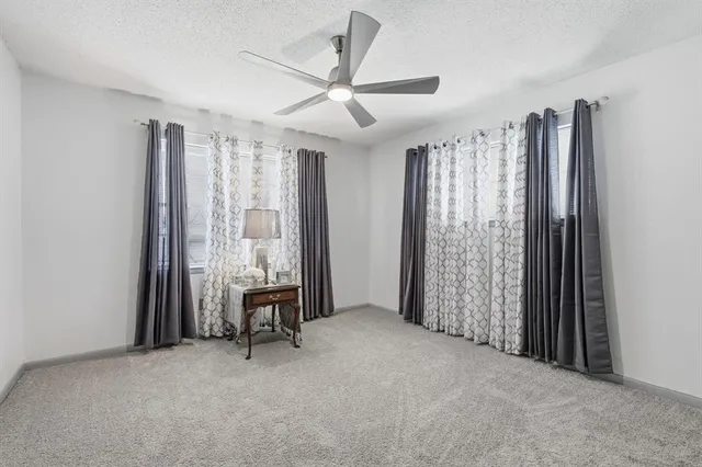 a view of workspace with furniture and a window