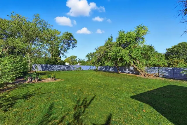 a view of a golf course with a lake view