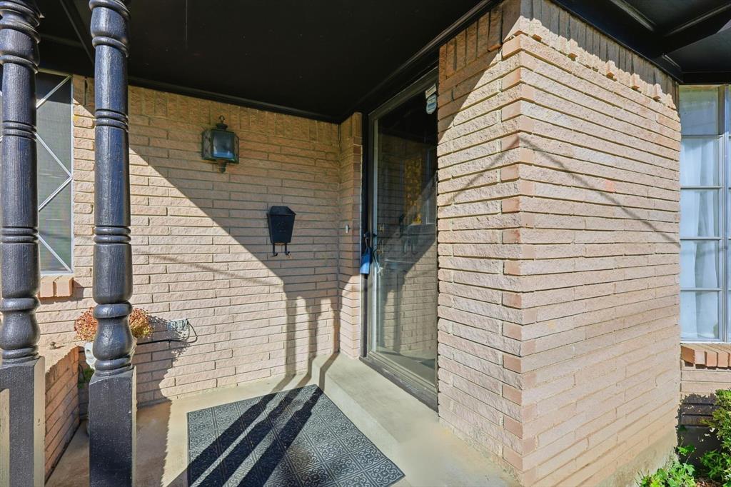 910 Rockwall Street McKinney, TX 75069 - Photo 3 of 34 Entrance to property with brick siding