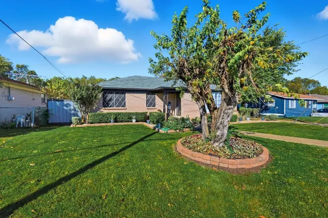 a view of a house with a garden