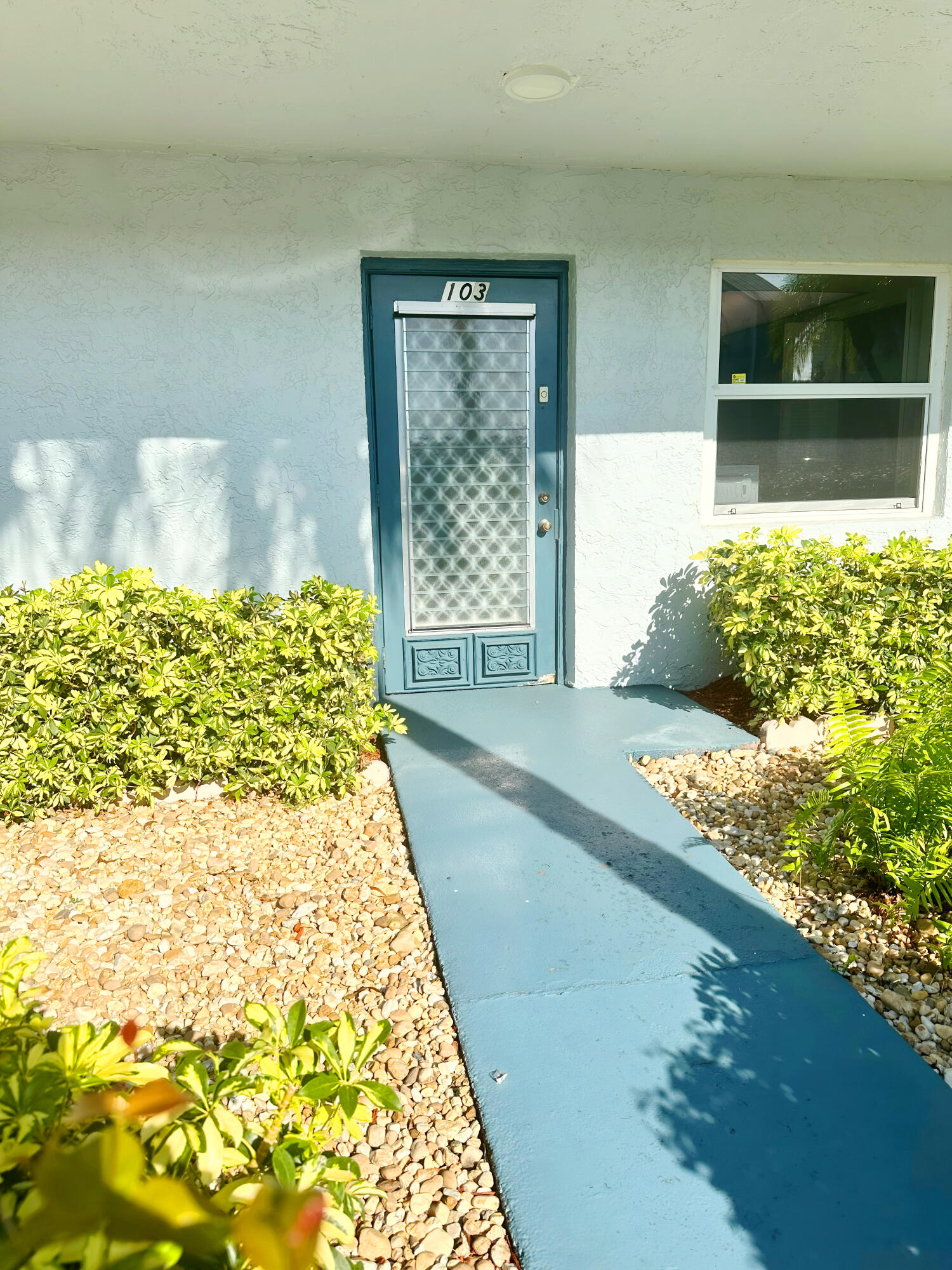 7664 Northwest 18th Street, Unit 103 Margate, FL 33063 - Photo 1 of 7 a front view of a house with a yard