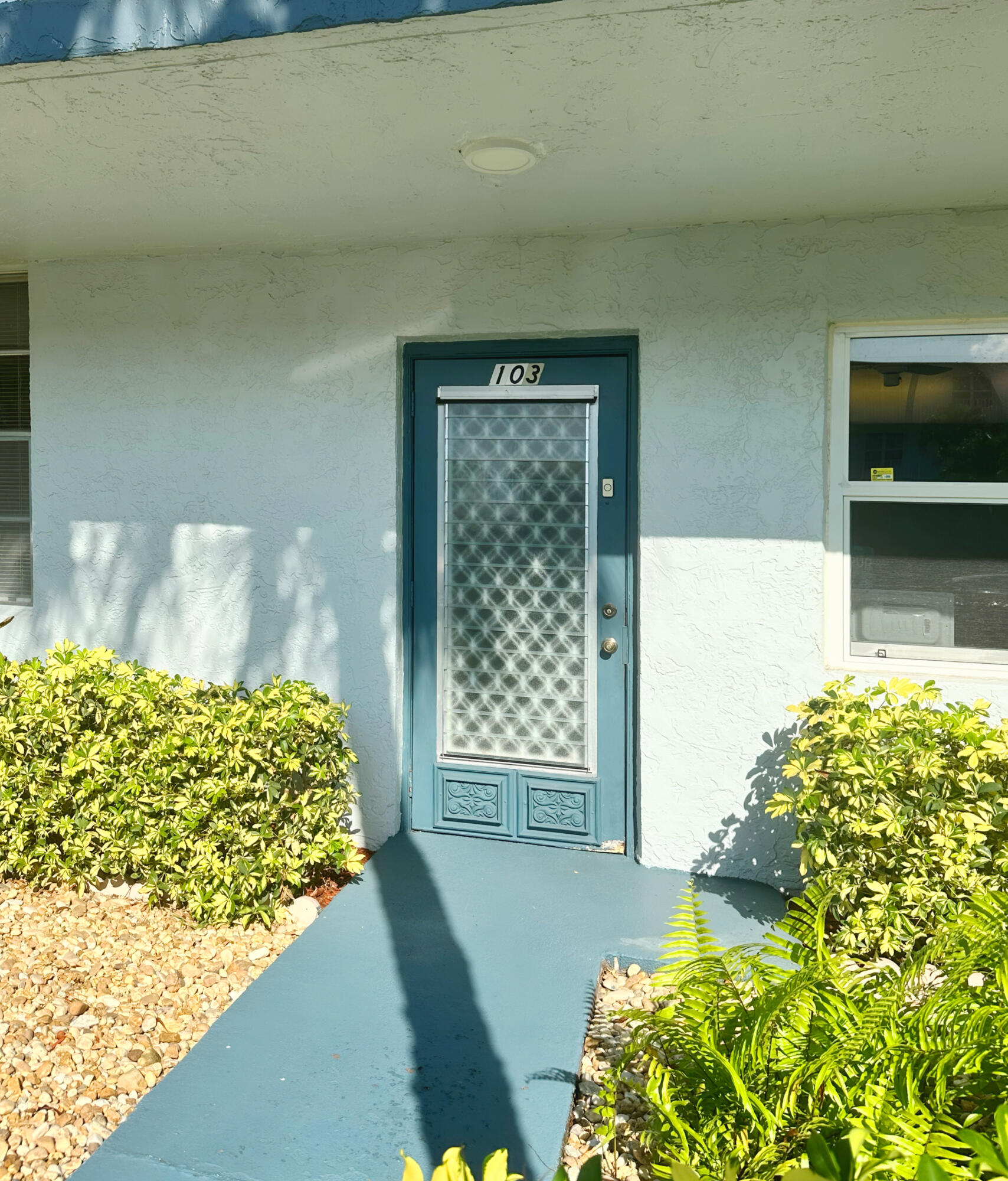 7664 Northwest 18th Street, Unit 103 Margate, FL 33063 - Photo 2 of 7 a front view of a house