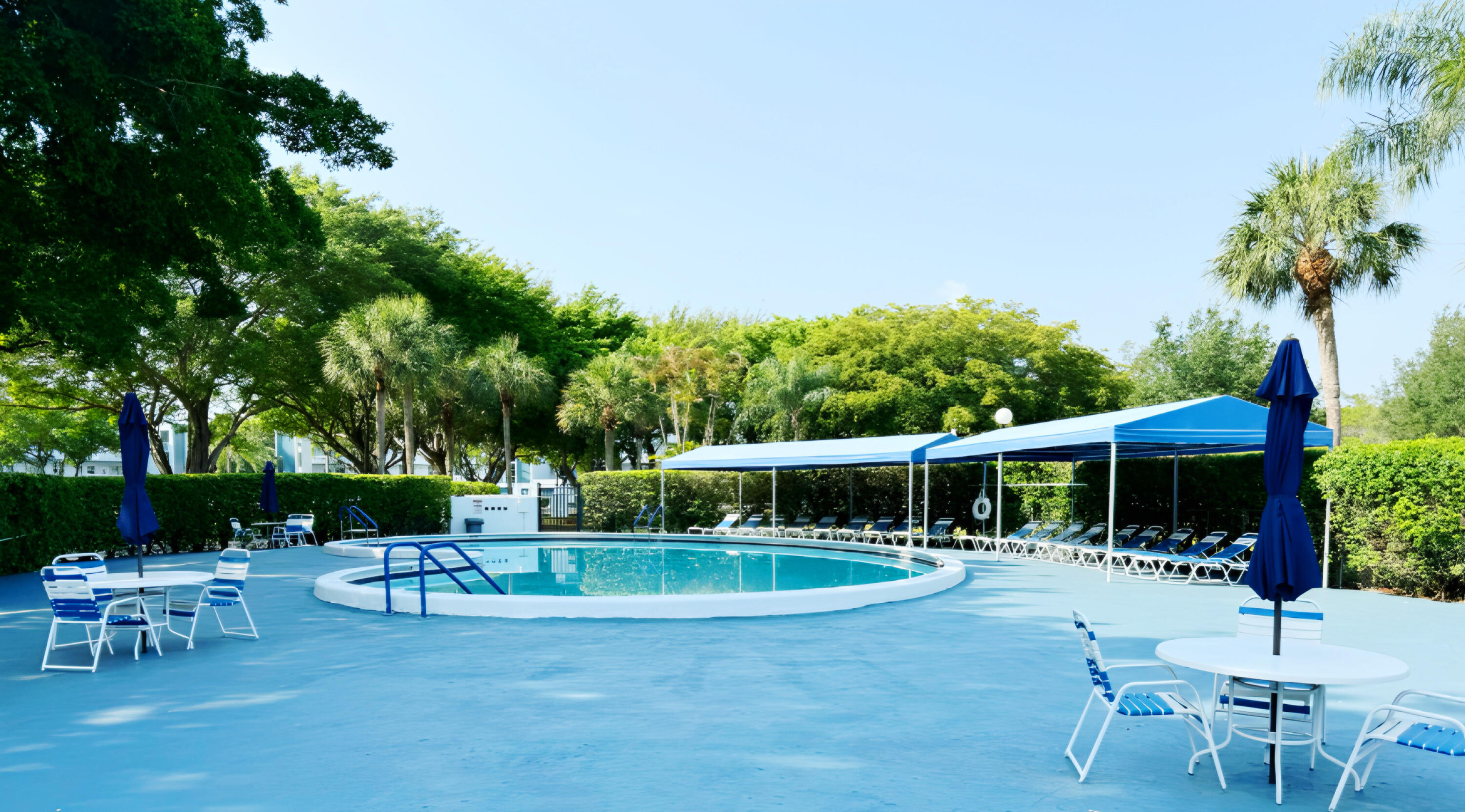 7664 Northwest 18th Street, Unit 103 Margate, FL 33063 - Photo 7 of 7 a view of a chair and tables in the patio