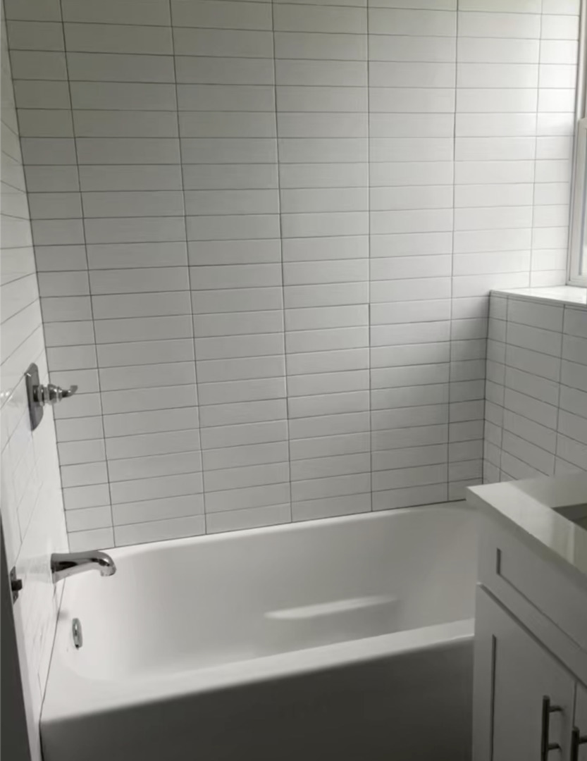 3839 West 14th Street, Unit 1 Chicago, IL 60623 - Photo 7 of 10 a bathroom with a bathtub and shower