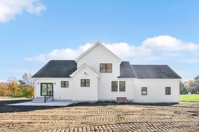 a view of front of house with a yard