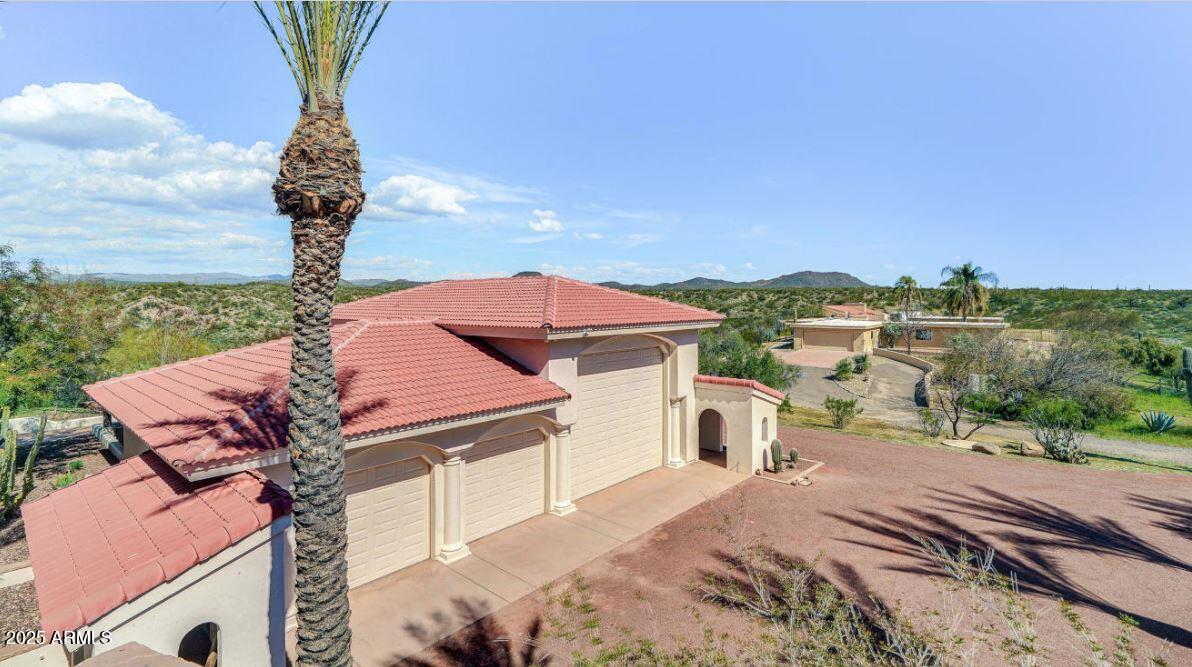 28331 West Rocking Horse Lane Morristown, AZ 85342 - Photo 11 of 22 a front view of a house with a yard