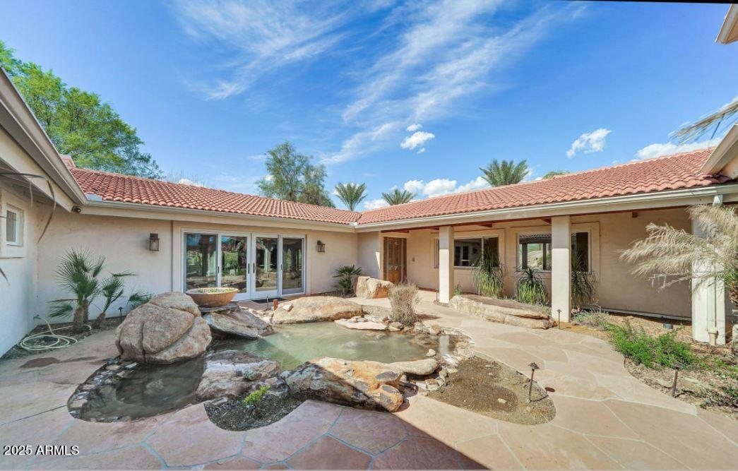 28331 West Rocking Horse Lane Morristown, AZ 85342 - Photo 12 of 22 a front view of a house with garden