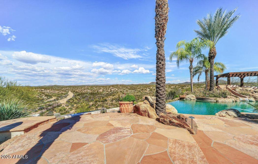 28331 West Rocking Horse Lane Morristown, AZ 85342 - Photo 14 of 22 a view of a ocean with a nearby beach