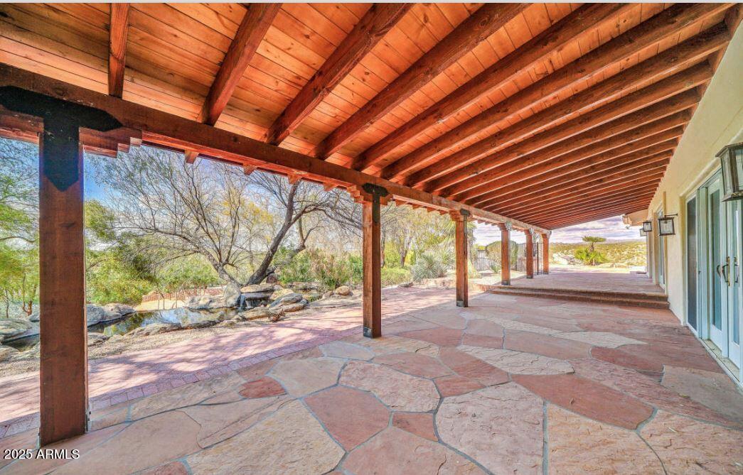 28331 West Rocking Horse Lane Morristown, AZ 85342 - Photo 9 of 22 a view of empty room with wooden floor and fence
