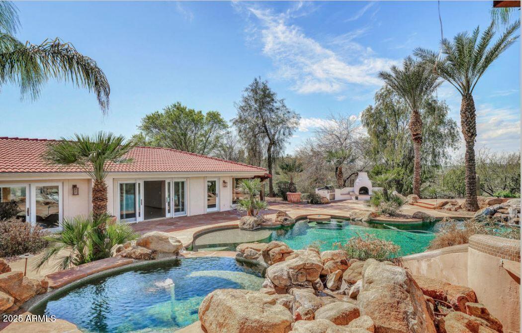 28331 West Rocking Horse Lane Morristown, AZ 85342 - Photo 10 of 22 a swimming pool with outdoor seating and yard