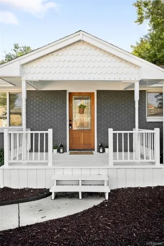a front view of a house with a wooden fence